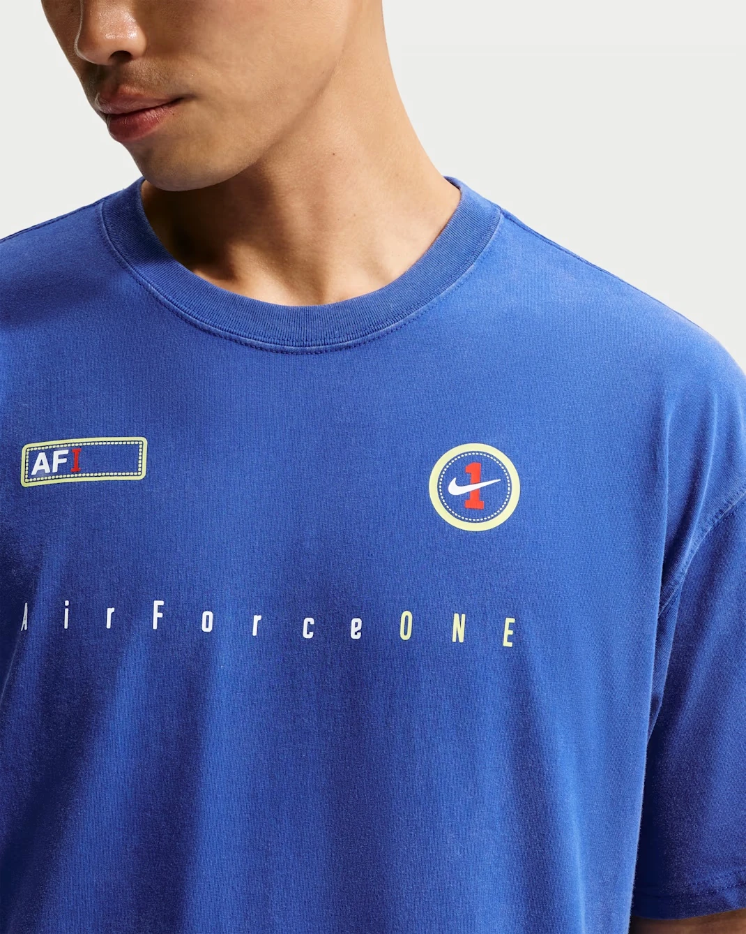 Front detail of the Nike Sportswear AF1 T-Shirt in Old Royal with Air Force 1 graphics.