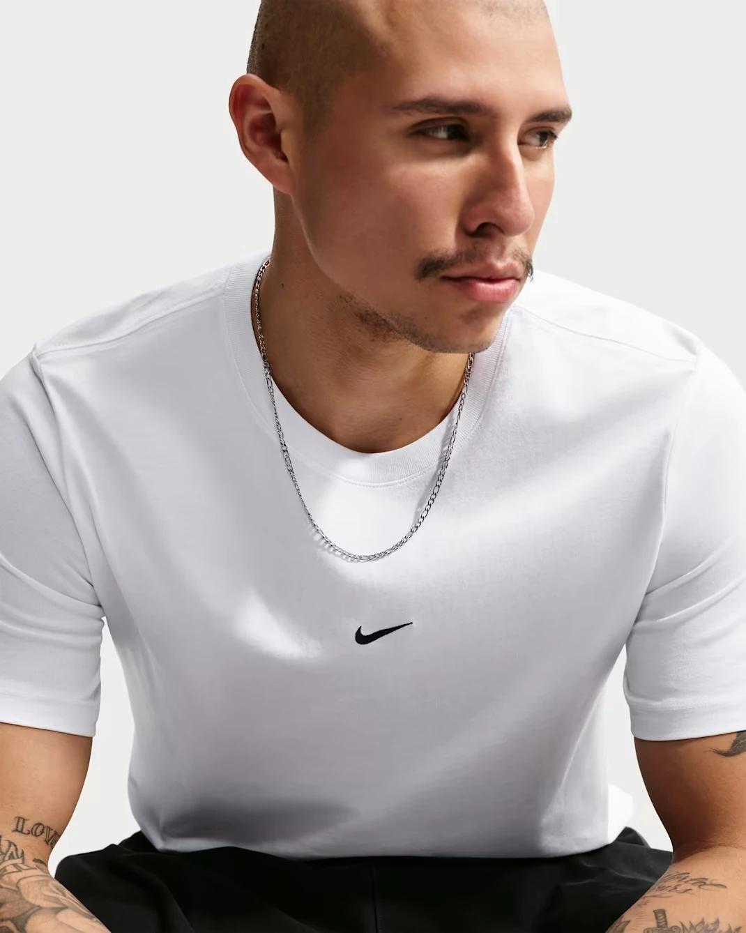 Nike Sportswear Men's T-Shirt in white with a black Swoosh logo.