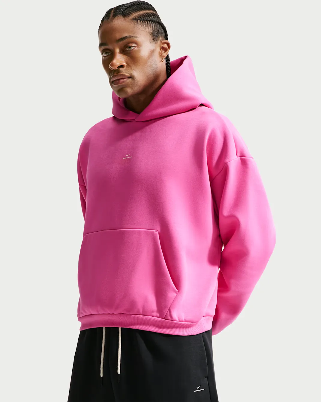 Front view of the Nike Standard Issue Therma-FIT Brushed Basketball Pullover Hoodie in Pink.