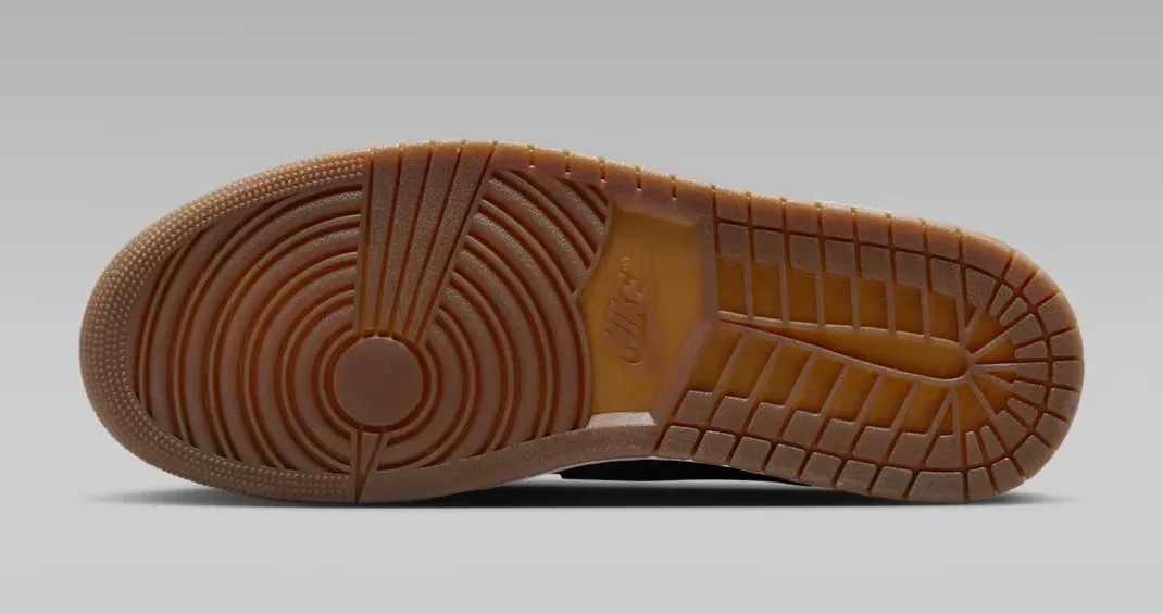Gum rubber outsole of the Air Jordan 1 Low OG Laser in Black, Summit White and Varsity Red.