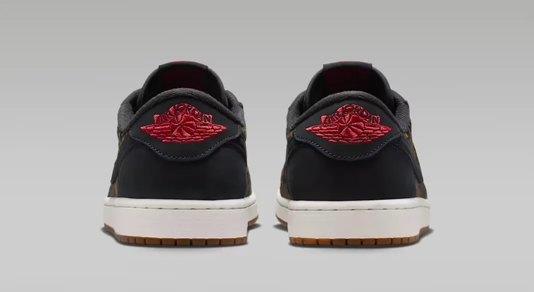 Rear view of the Air Jordan 1 Low OG Laser with black heels and Varsity Red Wings logos.