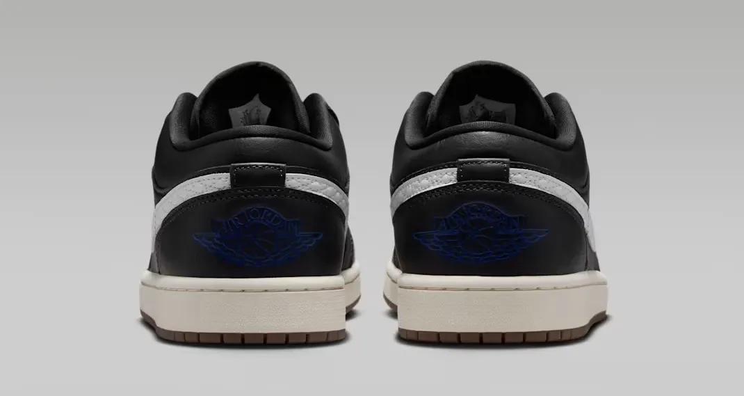 Rear heel view of the Air Jordan 1 Low SE Quilted "Off Noir" with Game Royal Wings logos.