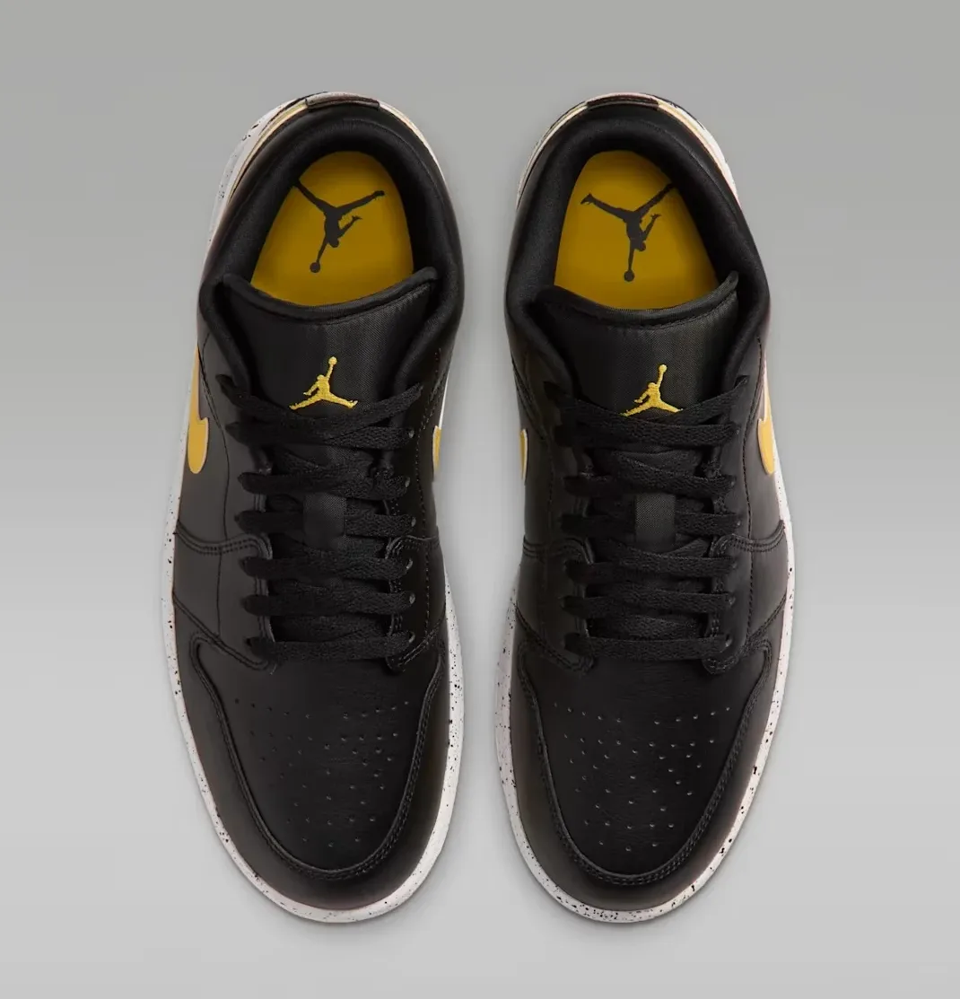 Top view of the Air Jordan 1 Low Tour Yellow showing black uppers and Tour Yellow Jumpman details.