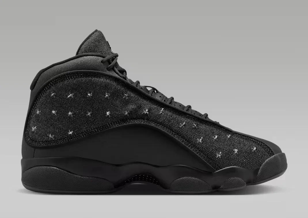 Lateral side view of the Air Jordan 13 Retro Wings in Black and Anthracite with embroidered Wings-inspired textile upper.