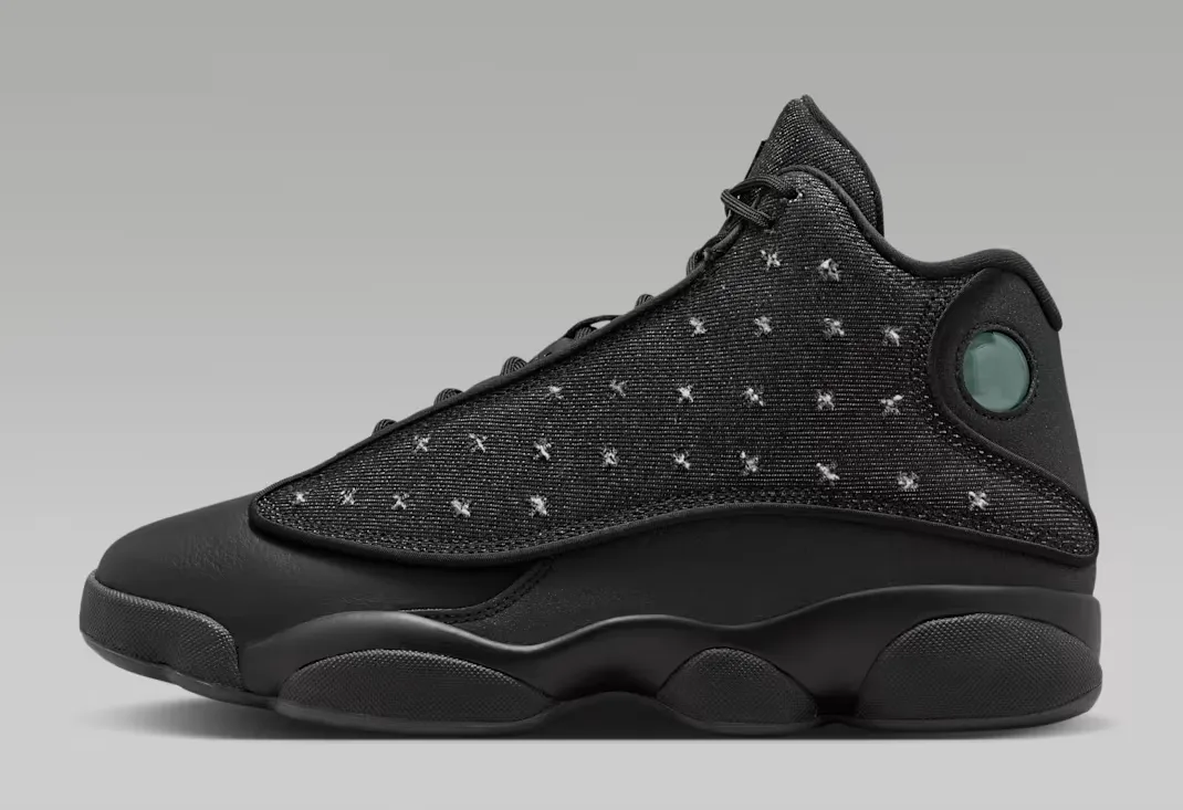 Side view of the Air Jordan 13 Retro Wings in Black and Anthracite with embroidered Wings-inspired textile upper.