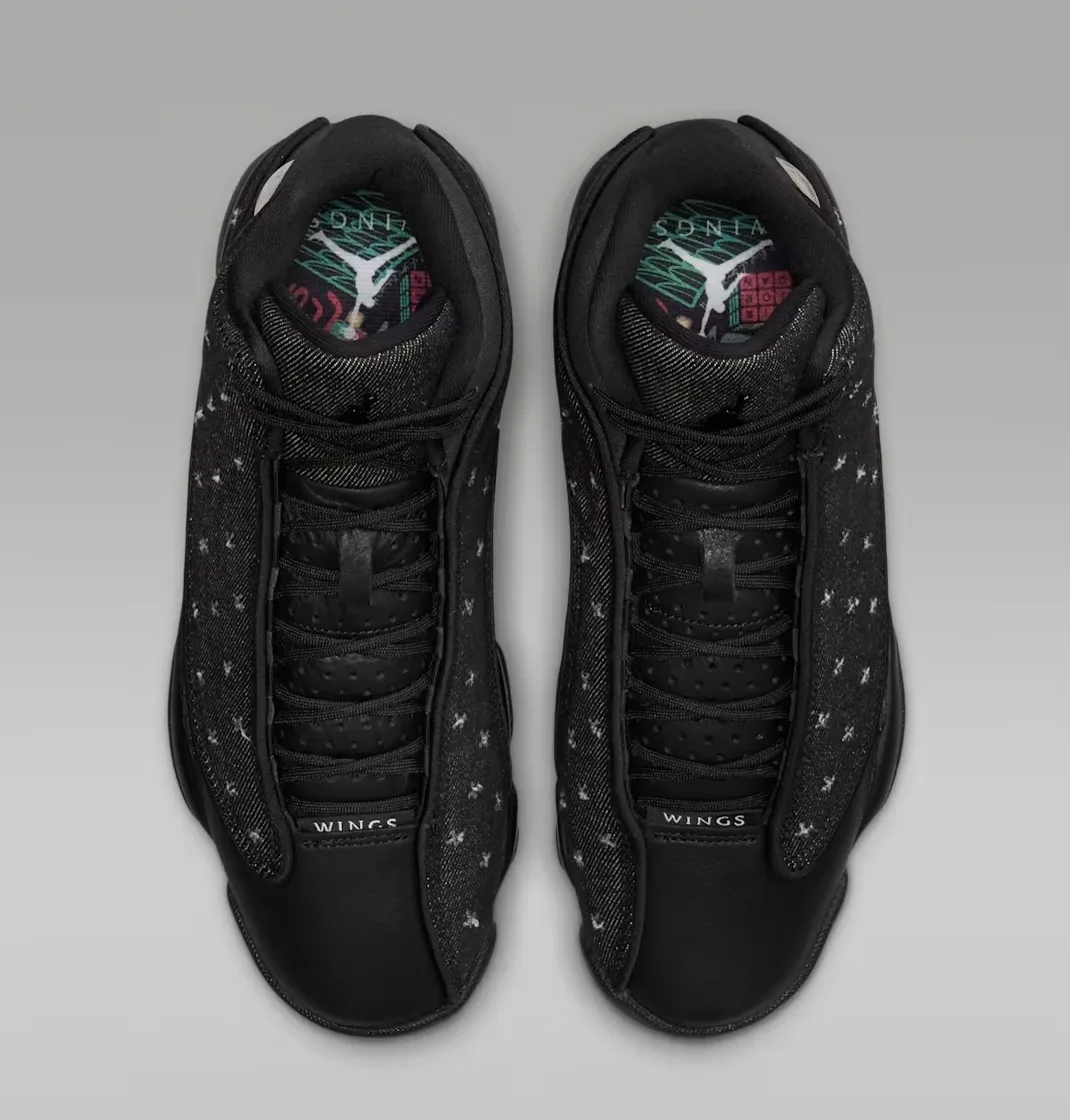 Top-down view of the Air Jordan 13 Retro Wings showing black laces, tongue and colorful graphic insoles.