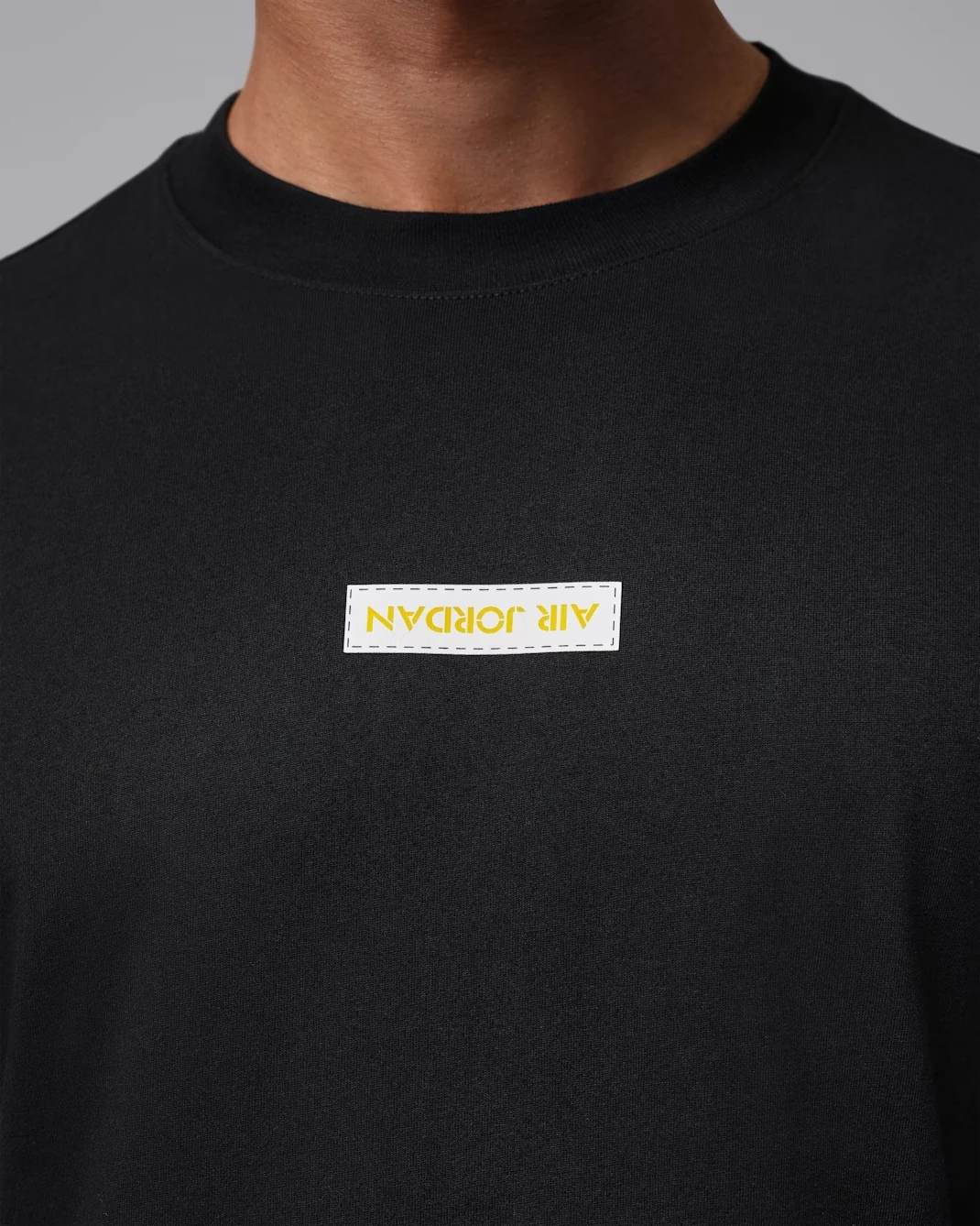 Air Jordan 4 Tour Yellow 2026 T-Shirt black front logo detail