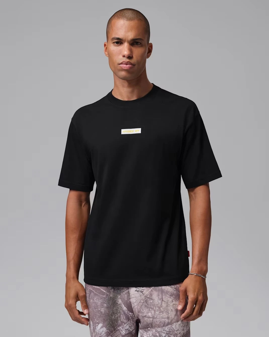 Air Jordan 4 Tour Yellow 2026 T-Shirt in black and yellow front view