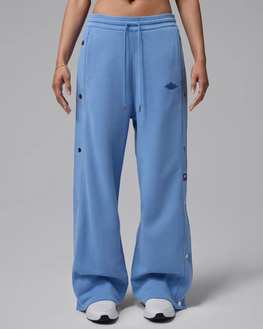 Air Jordan Women’s Flight Fleece snap-bottom pants in Blue Beyond