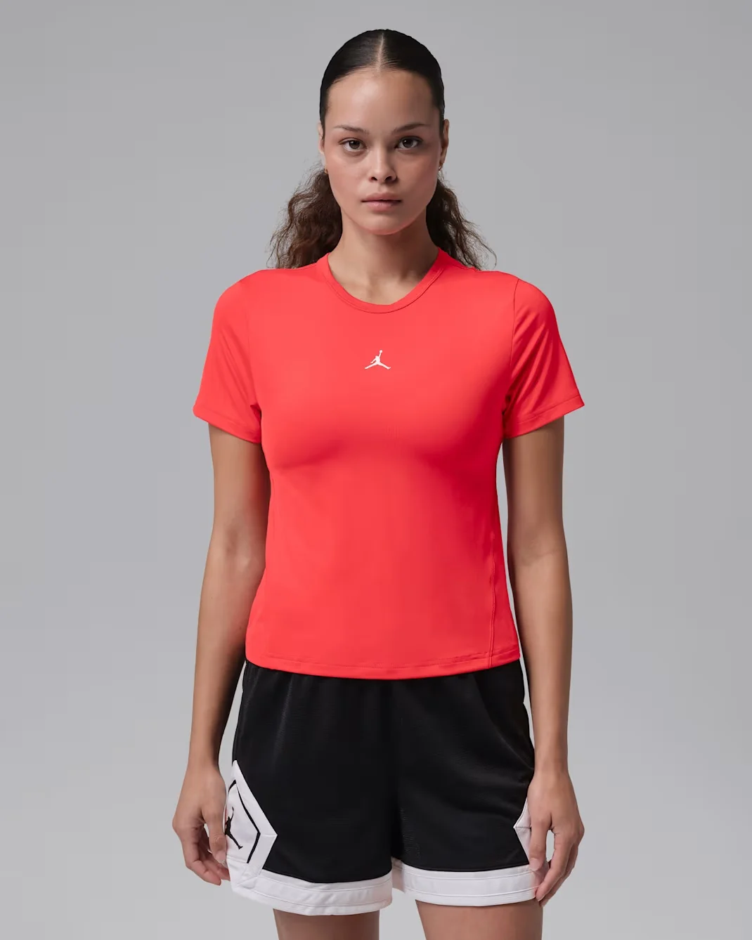 Air Jordan Women’s Sport Dri-FIT Essential Short-Sleeve Top in Track Red