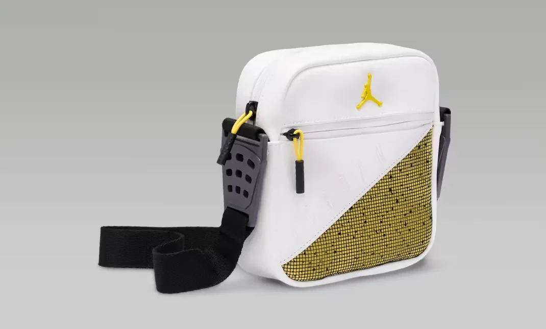 Angled view of Jordan AJ4 Tour Yellow crossbody bag in white, yellow and black.