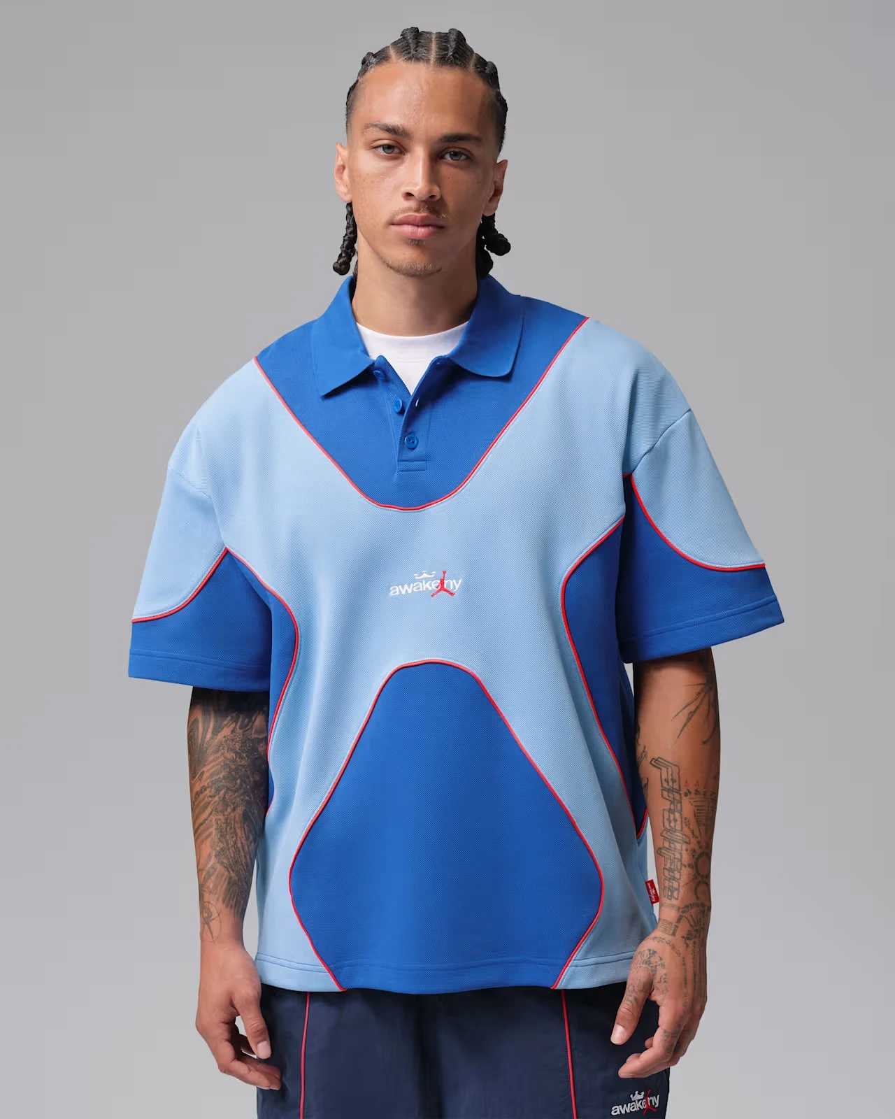 Jordan x Awake NY polo in Game Royal and Light Blue with Infrared 23 piping.