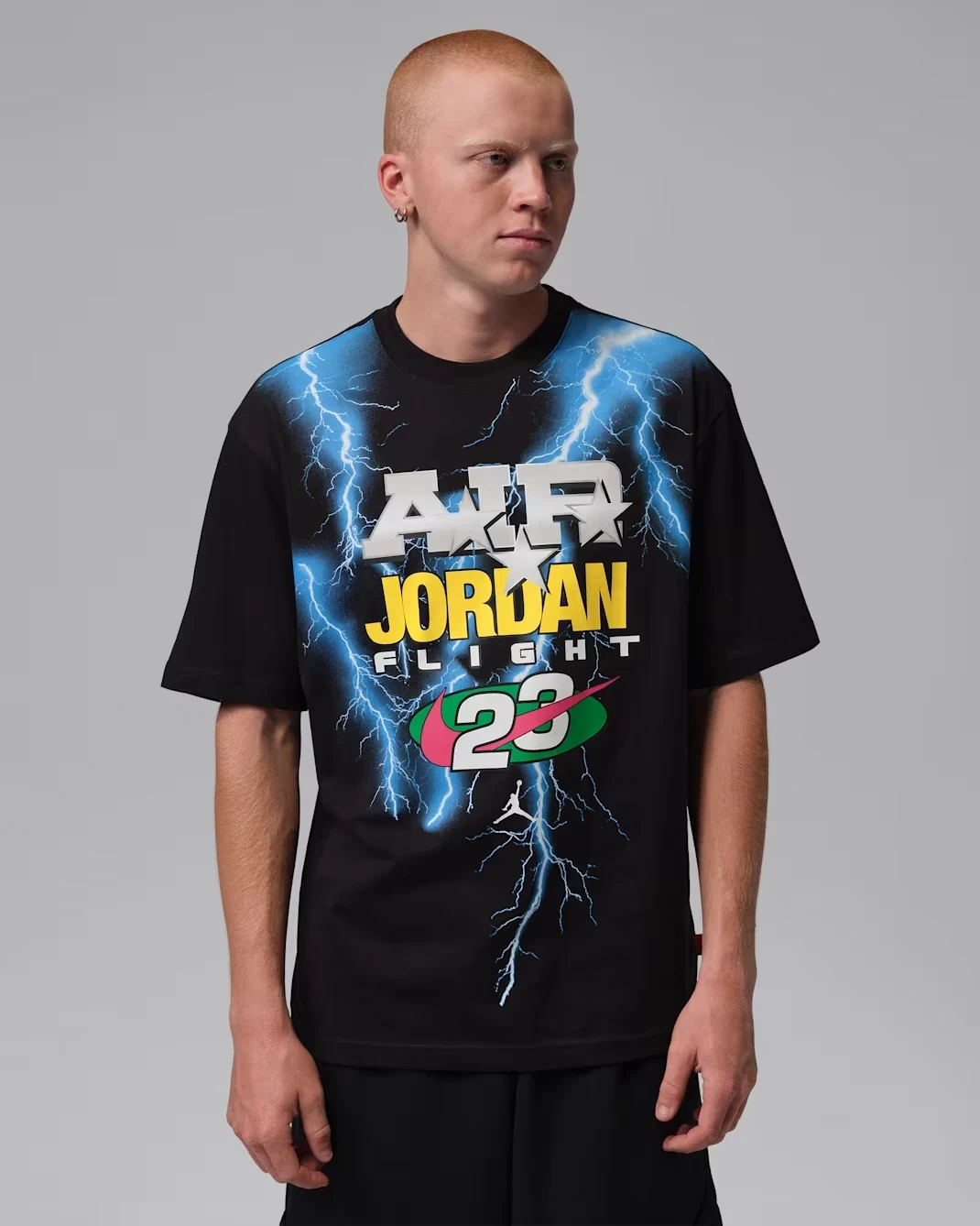 Jordan Brooklyn black graphic T-shirt with blue lightning and yellow Jordan Flight graphics.