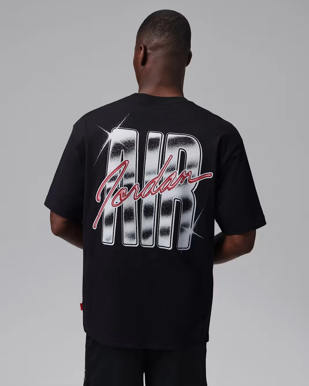 Back view of the black Jordan Brooklyn men's T-shirt with oversized white Air Jordan graphic