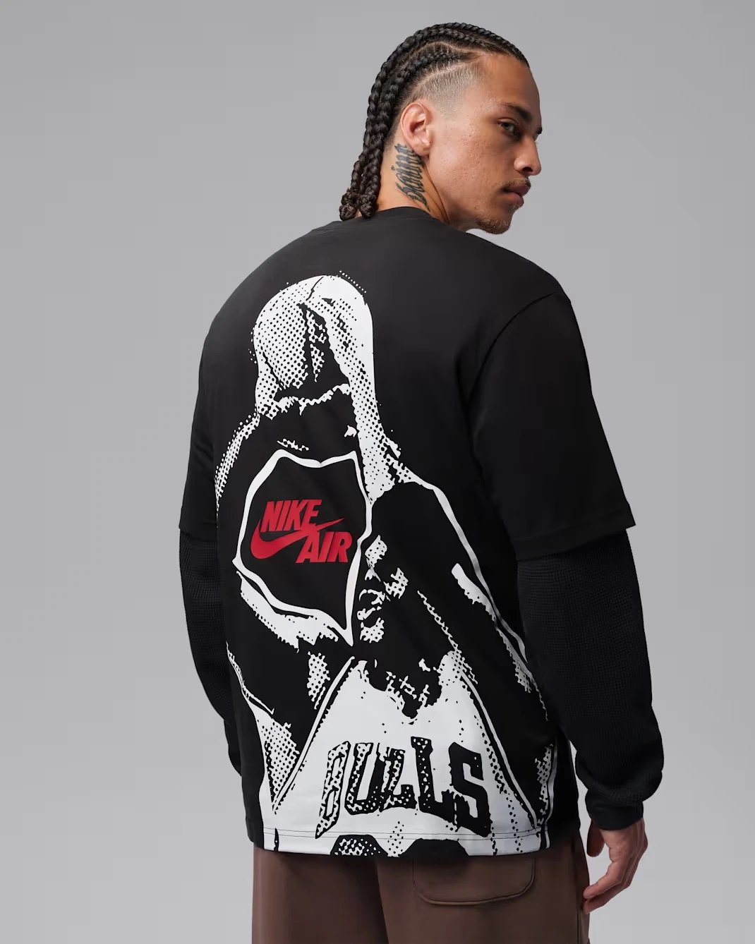 Back view of the Jordan Brooklyn Men's T-Shirt in Off Noir featuring Nike Air and Bulls-inspired graphics.