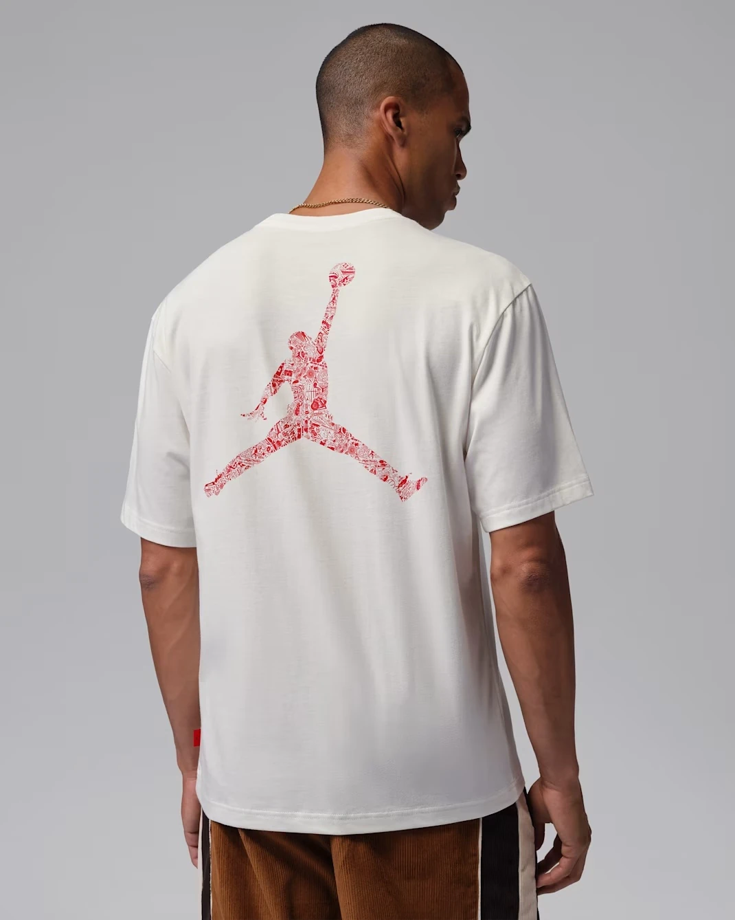 Back view of the Jordan Brooklyn Men's T-Shirt in Sail featuring a large University Red Jumpman graphic.