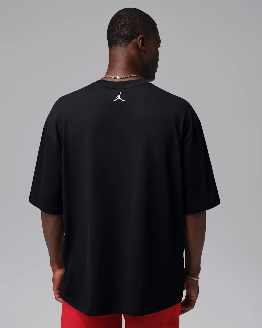 Back view of the black Jordan oversized T-shirt with chrome Air Jordan graphic