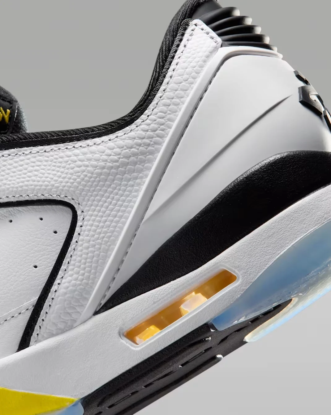 Close-up of the Jordan Sixty Plus Low Tour Yellow heel and visible Air cushioning.