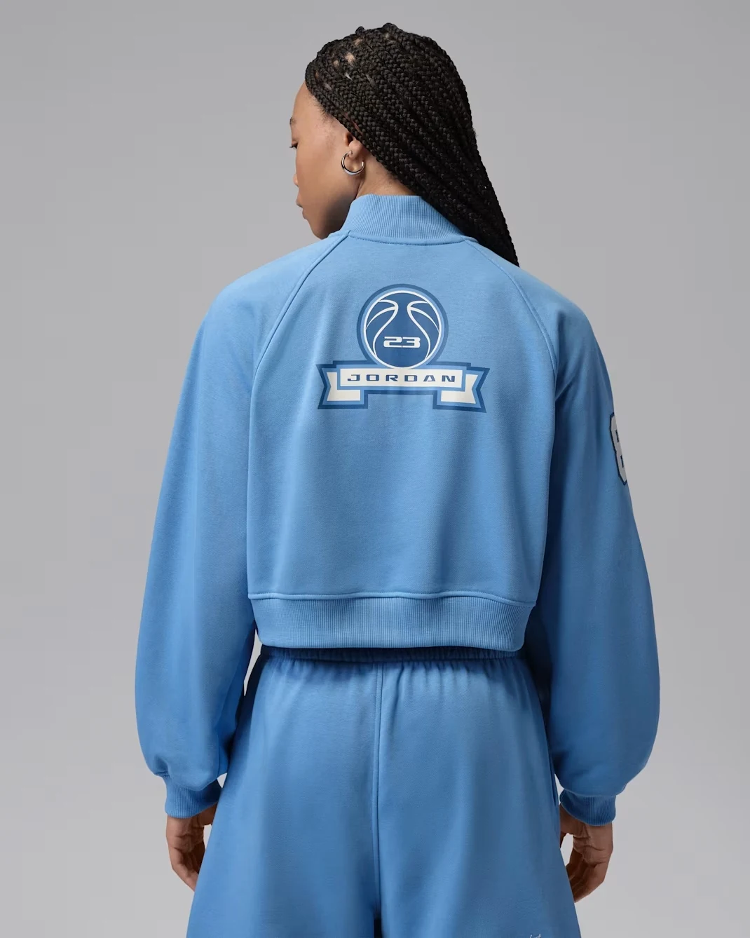 Back view of Jordan Women’s Brooklyn Fleece cropped quarter-zip in Blue Beyond