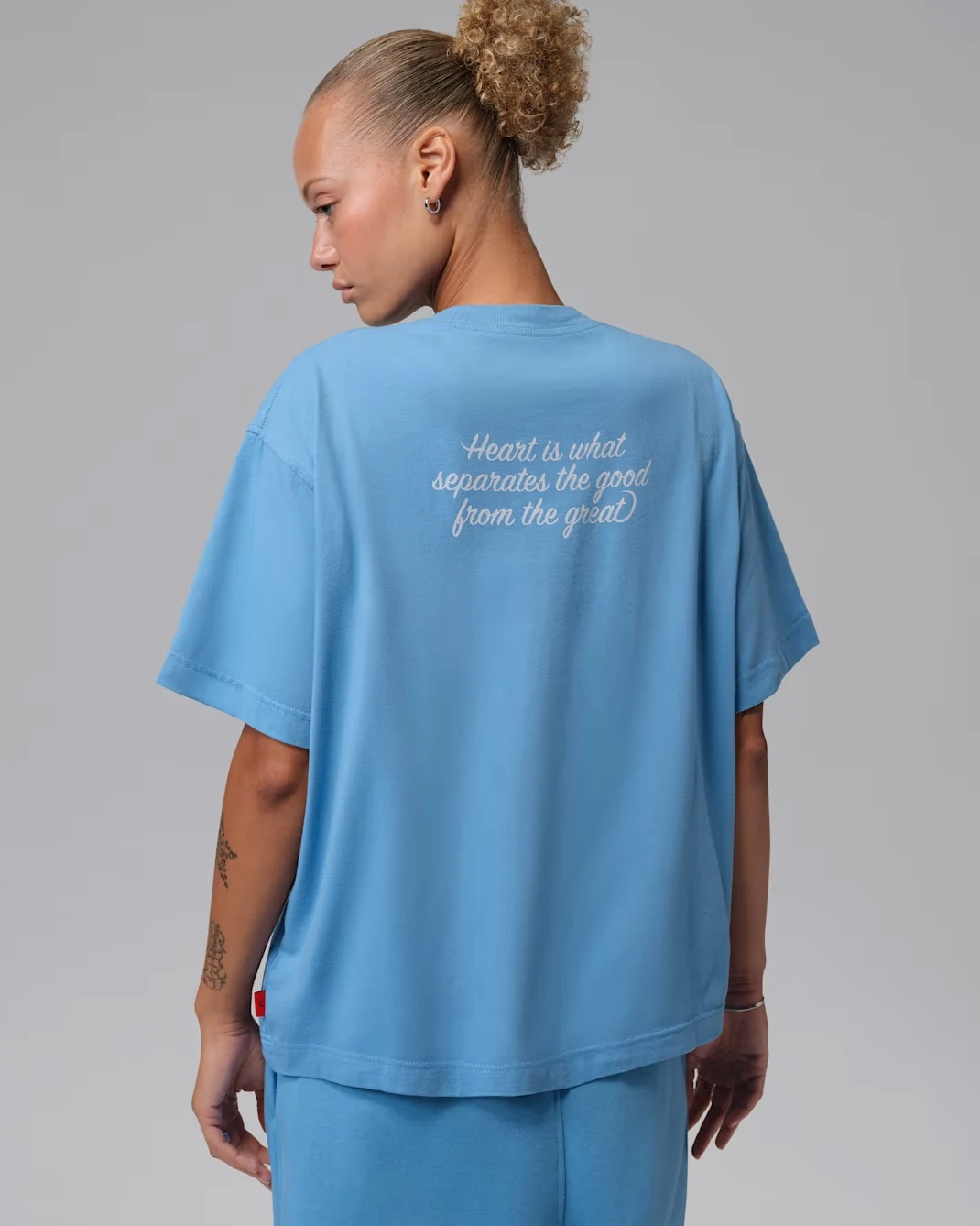 Back view of Jordan Women’s graphic T-shirt in Blue Beyond