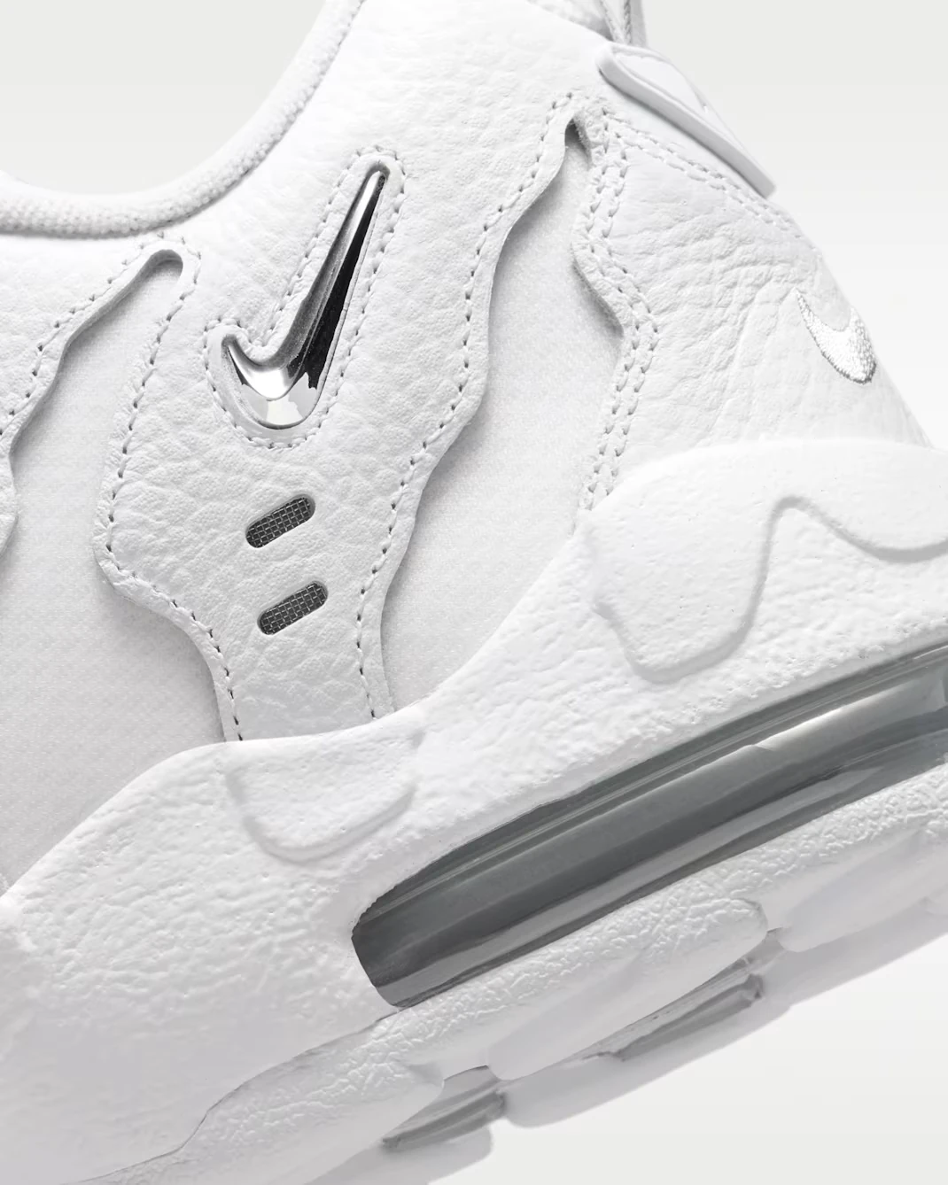 Close-up of the visible Air Max unit and Metallic Silver Swoosh on the Nike Air DT Max '96 Low "Triple White."