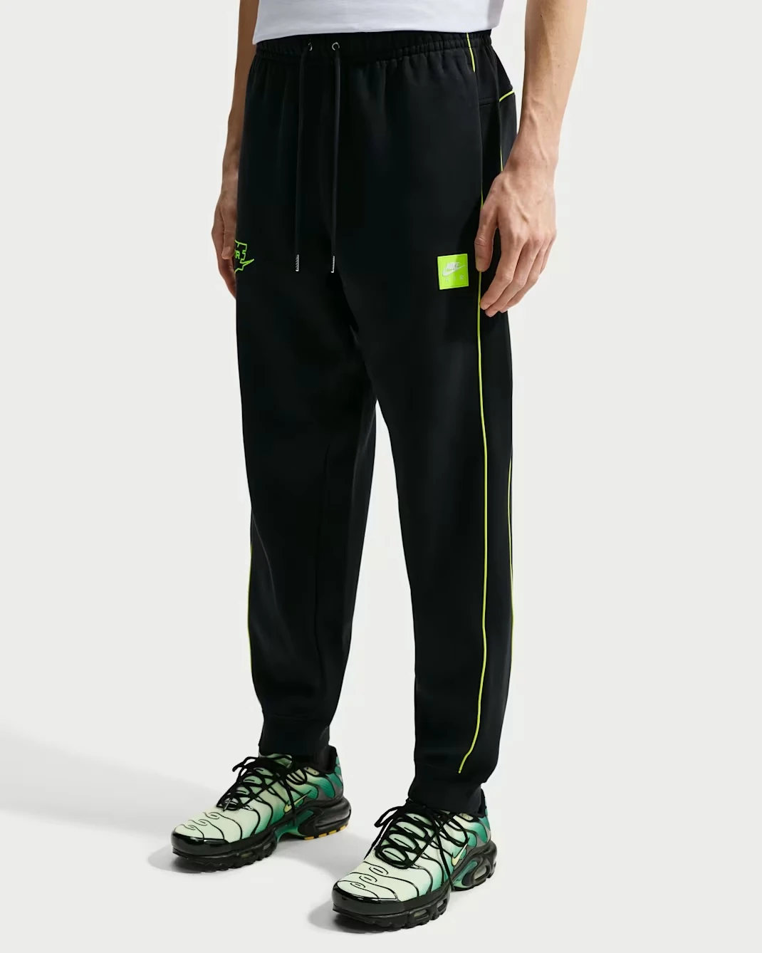 Nike Air Fleece Joggers in Black with Neon Yellow accents.