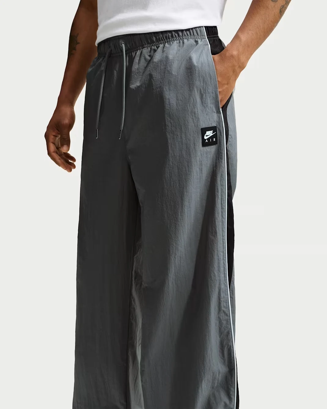 Nike Air woven track pants in Smoke Grey, black and white