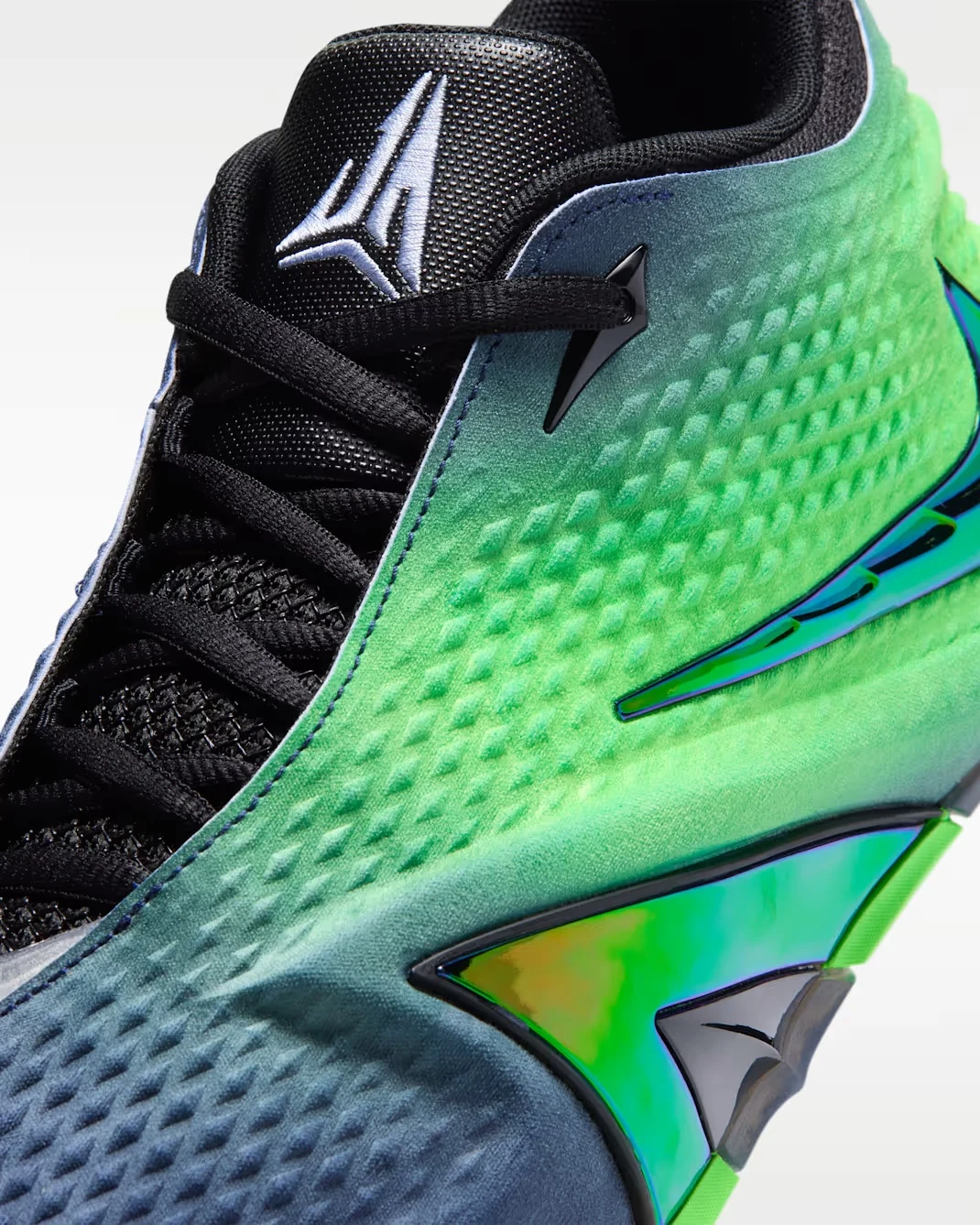 Close-up of the Nike Ja 4 Nightmare with Voltage Green, Obsidian and iridescent Multi-Color details.