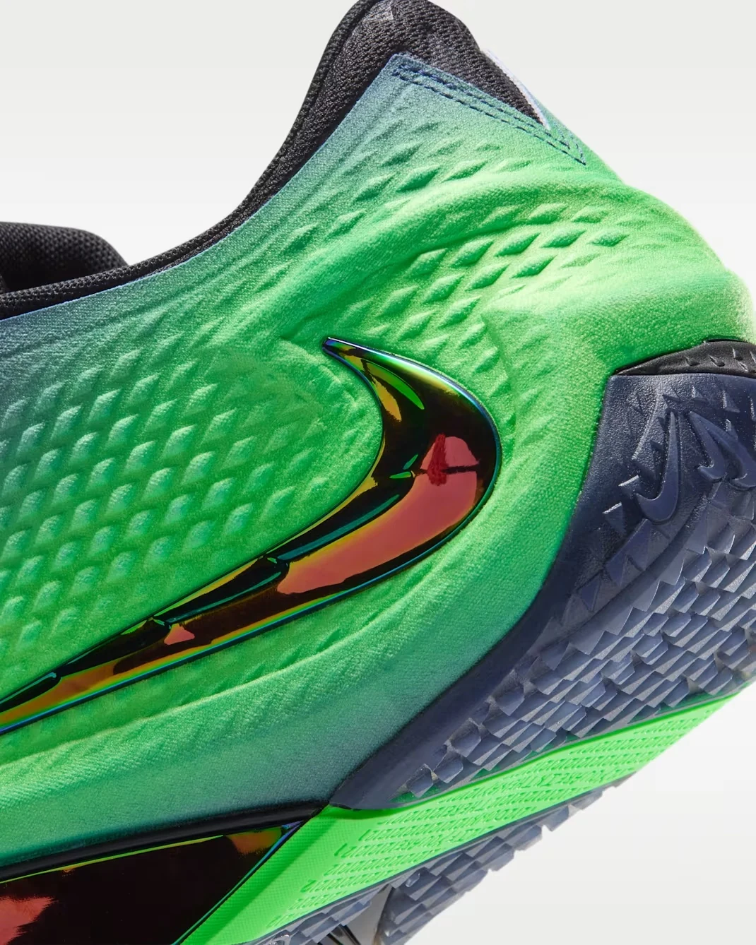 Close-up of the Nike Ja 4 Nightmare Voltage Green upper and iridescent Multi-Color Swoosh.