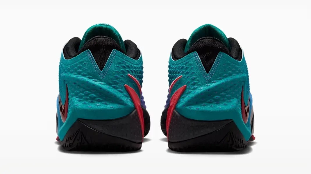 Rear view of the Nike Ja 4 NY vs. NY showing Rio Teal heels with black and Fruit Punch accents.