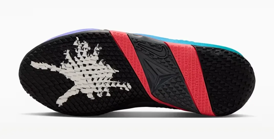 Outsole of the Nike Ja 4 NY vs. NY featuring black, Fruit Punch and white details.