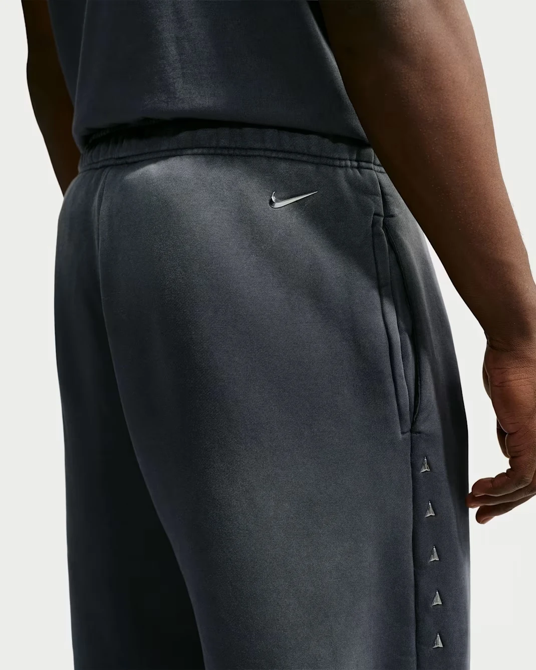 Detail of Nike Ja Standard Issue Therma-FIT fleece pants in Black and Ice Silver.