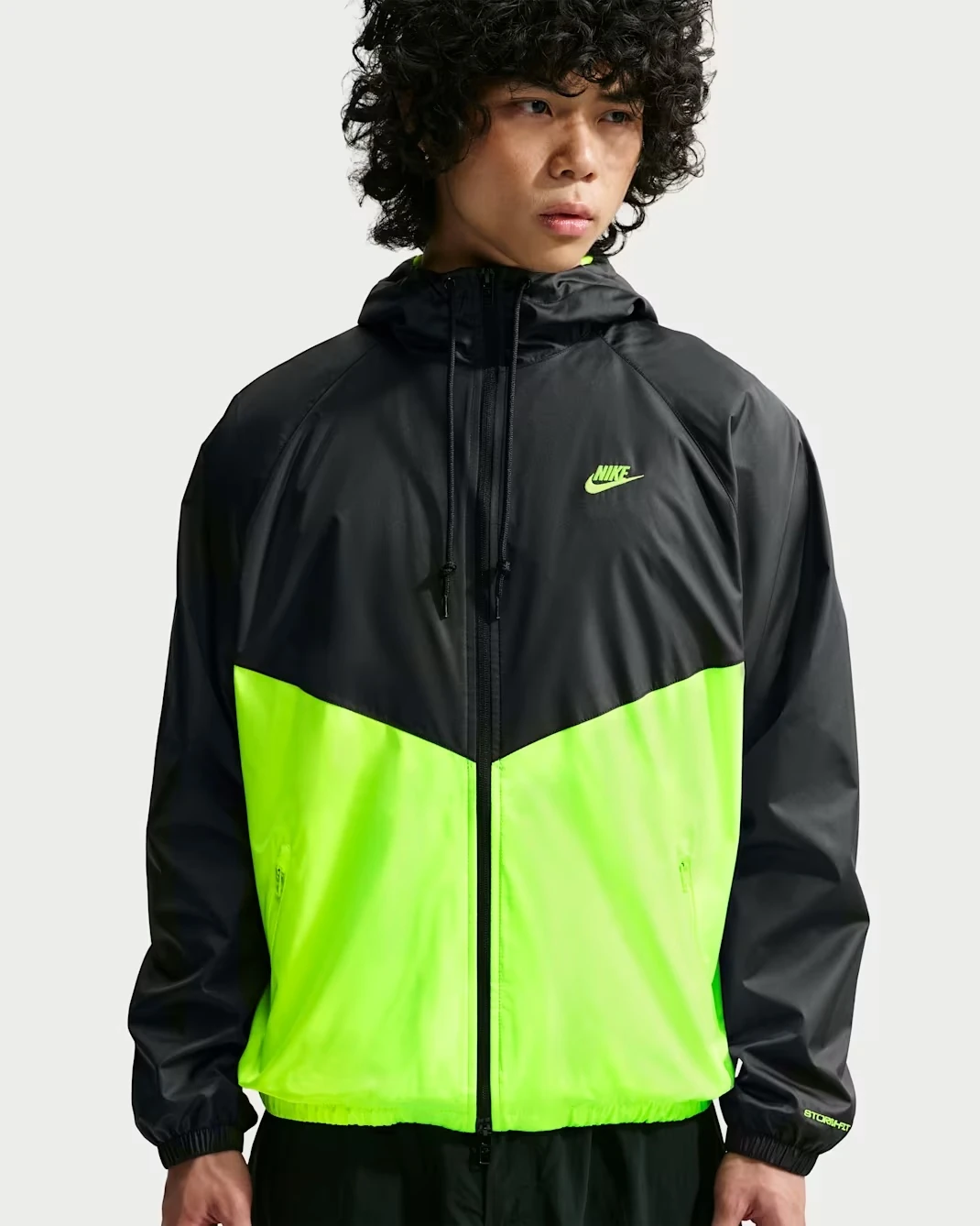 Nike Sportswear Windrunner Lined Jacket in Black with Neon Yellow color blocking.