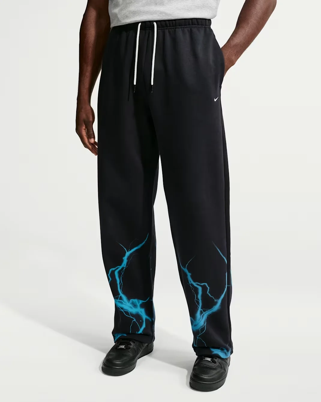 Detail view of Nike Therma-FIT skull pants in black and blue