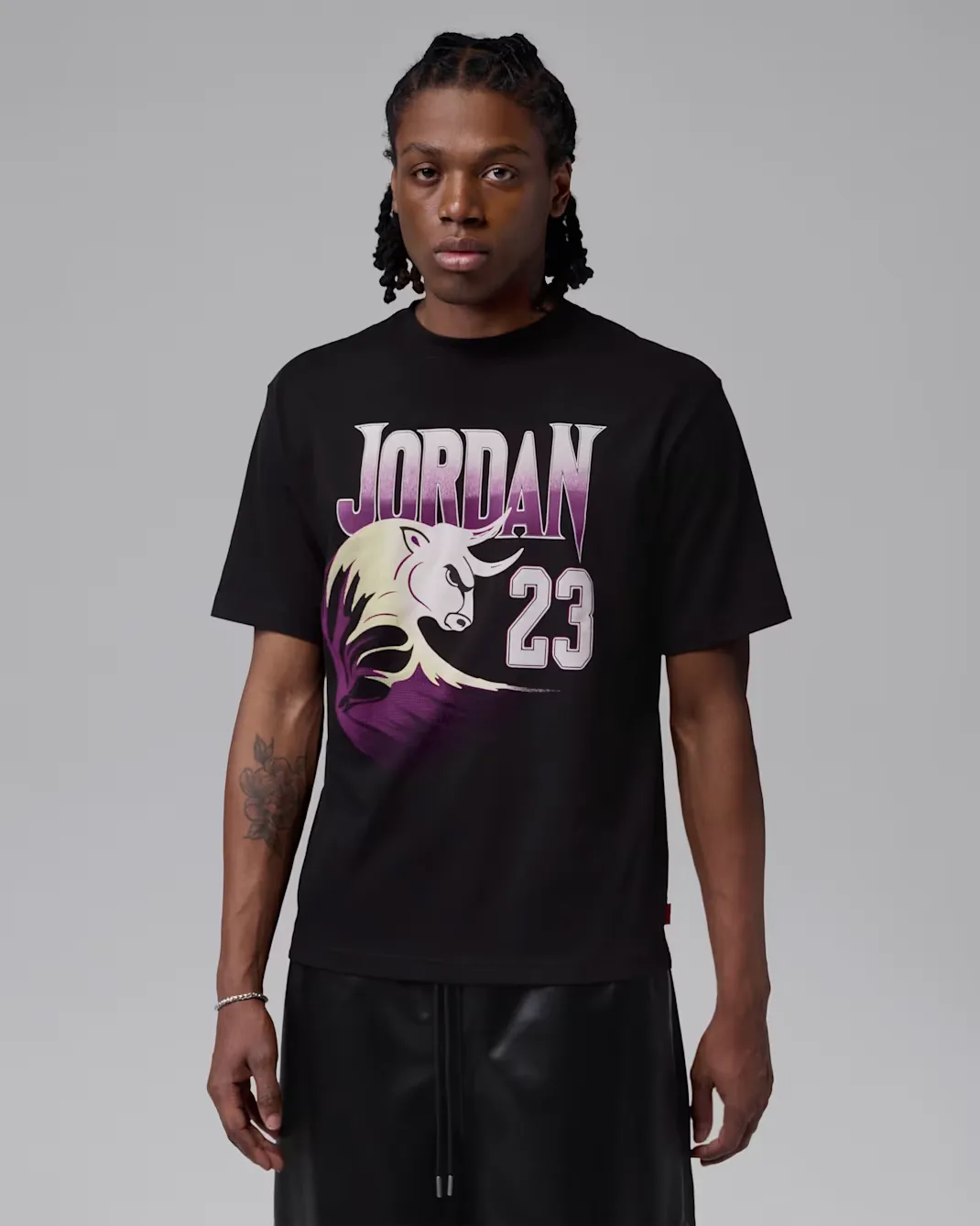 Black Jordan Brooklyn GOAT Graphic T-Shirt with purple and white details to match the Air Jordan 12 Bucks.