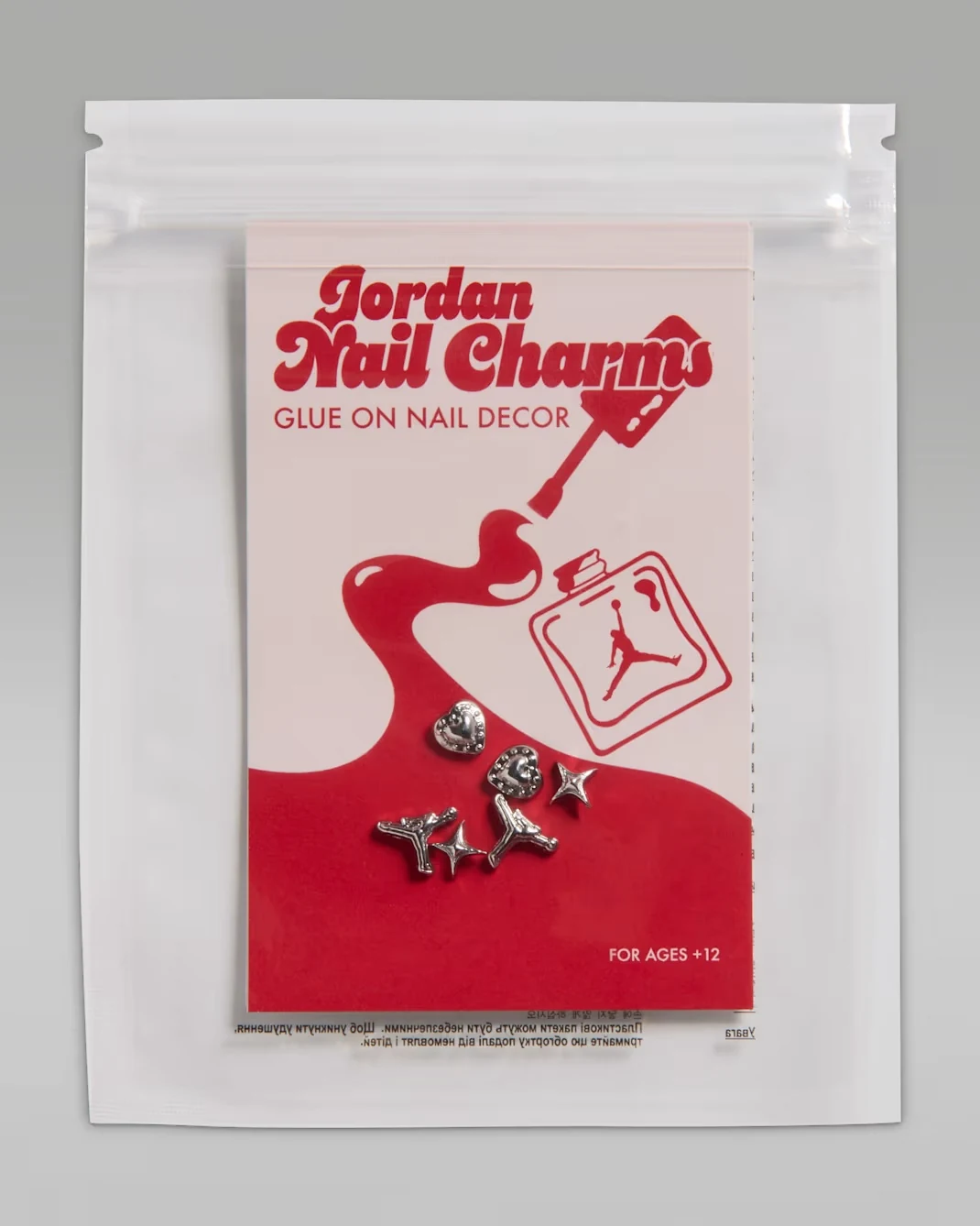 Air Jordan 1 High OG Nails and Grails Metallic Silver nail charms with red and pink packaging