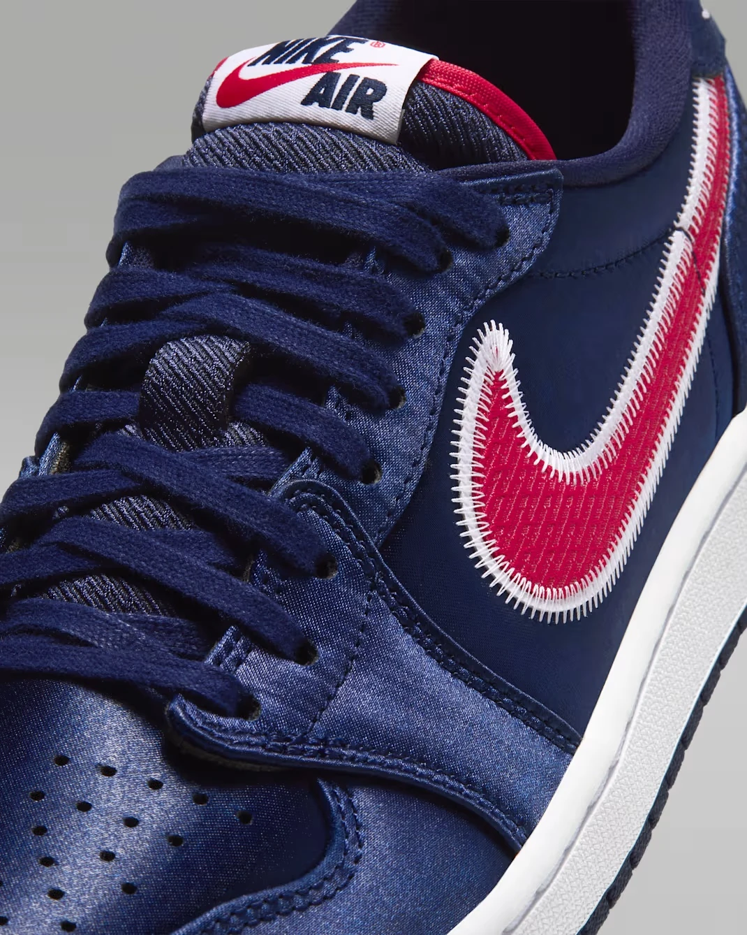 Air Jordan 1 Low OG “Howard” University Red and White Swoosh detail on College Navy upper