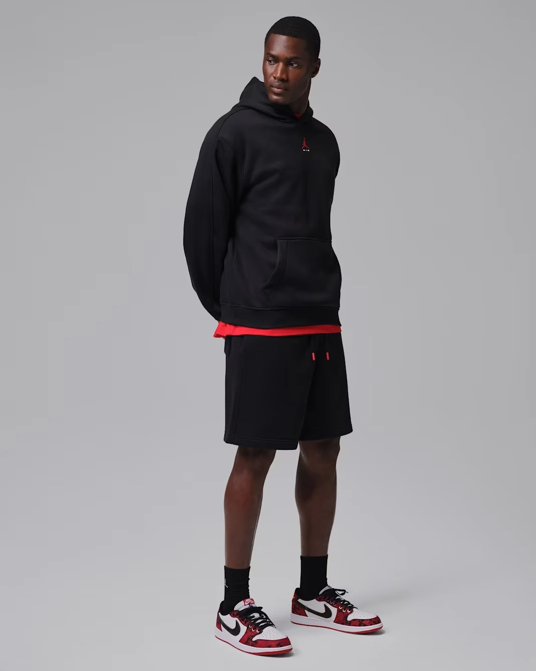 Black and red Jordan outfit styled with the Air Jordan 1 Low OG Welcome to the Garden.