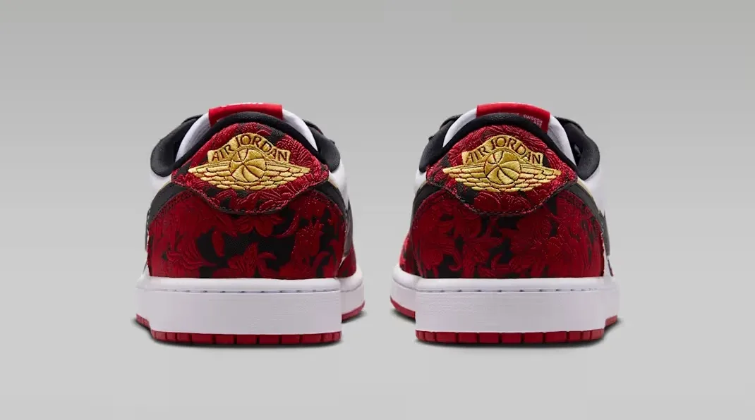 Heel view of the Air Jordan 1 Low OG Welcome to the Garden with red, black and gold details.