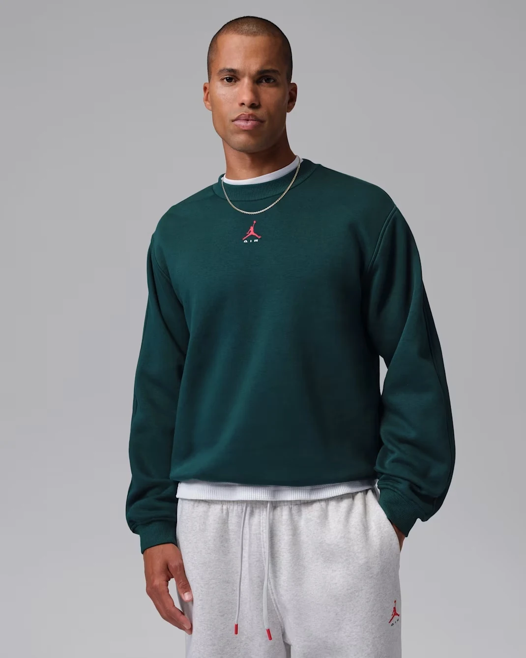 Jordan Brooklyn men’s crew-neck sweatshirt in Midnight Spruce with University Red Jumpman branding.