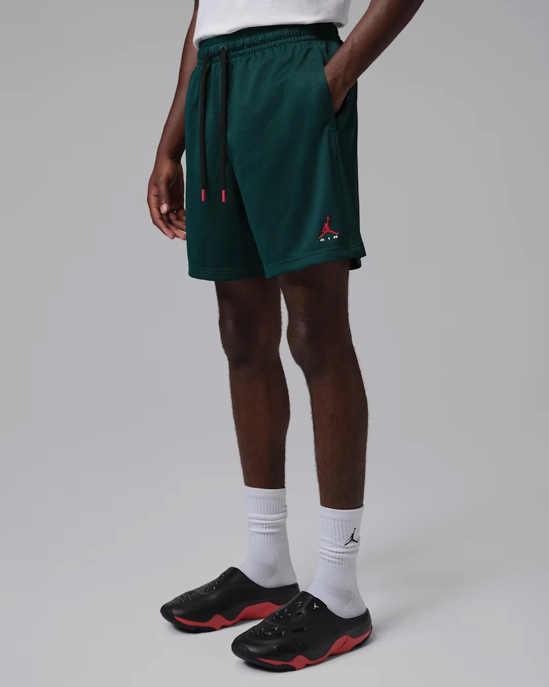 Jordan Brooklyn men’s mesh shorts in Midnight Spruce with University Red details.
