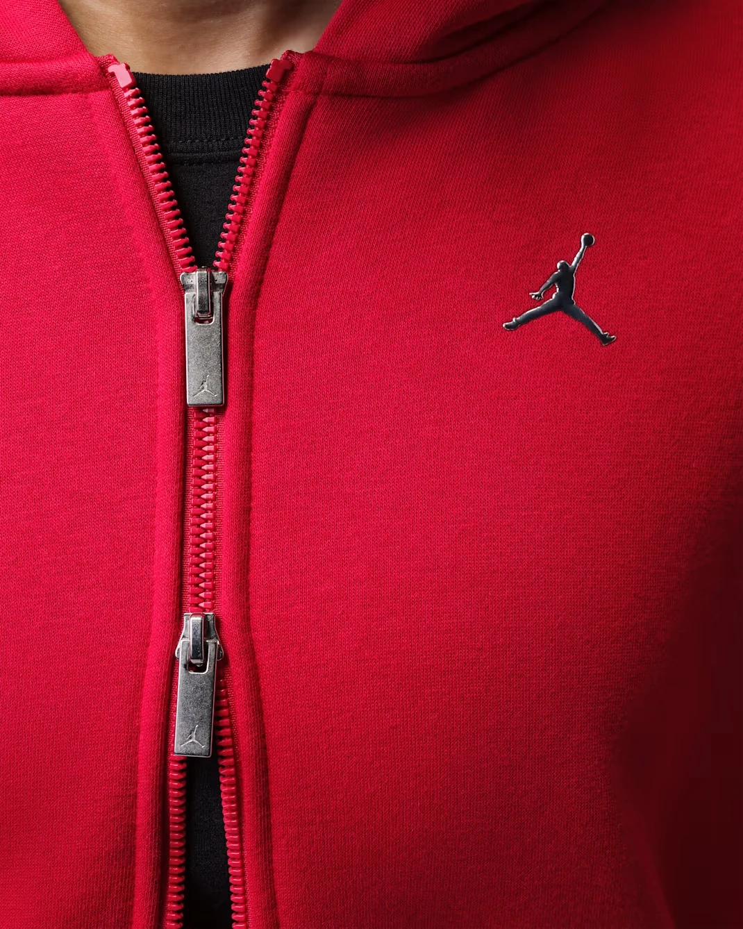 Close-up of Jordan Brooklyn women’s full-zip hoodie in Gym Red with Metallic Silver Jumpman