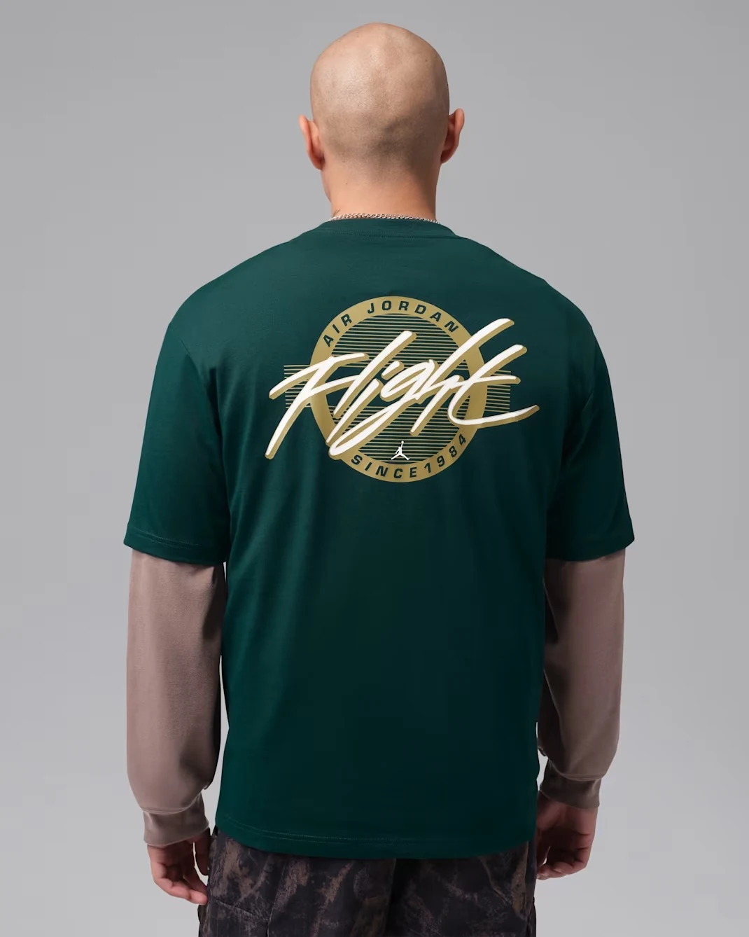Back view of the Jordan Flight men’s T-shirt in Midnight Spruce with Light Orewood Brown Flight graphic.