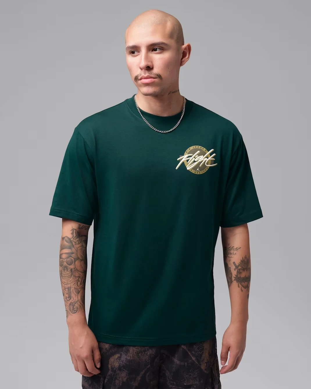Front view of the Jordan Flight men’s T-shirt in Midnight Spruce with Light Orewood Brown Flight graphic