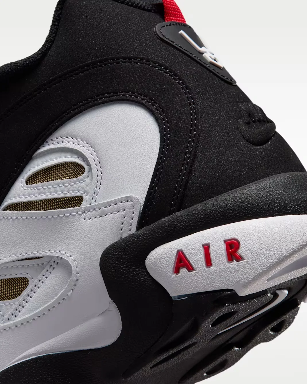 Close-up of the Nike Air Diamond Turf 2 heel with black, white and Fire Red Air branding.