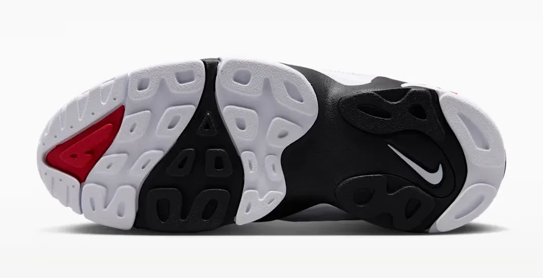Outsole of the Nike Air Diamond Turf 2 in Black, Fire Red, Metallic Gold and White.