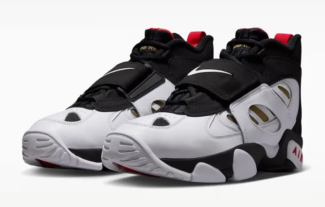 Pair of Nike Air Diamond Turf 2 sneakers in Black, Fire Red, Metallic Gold and White.