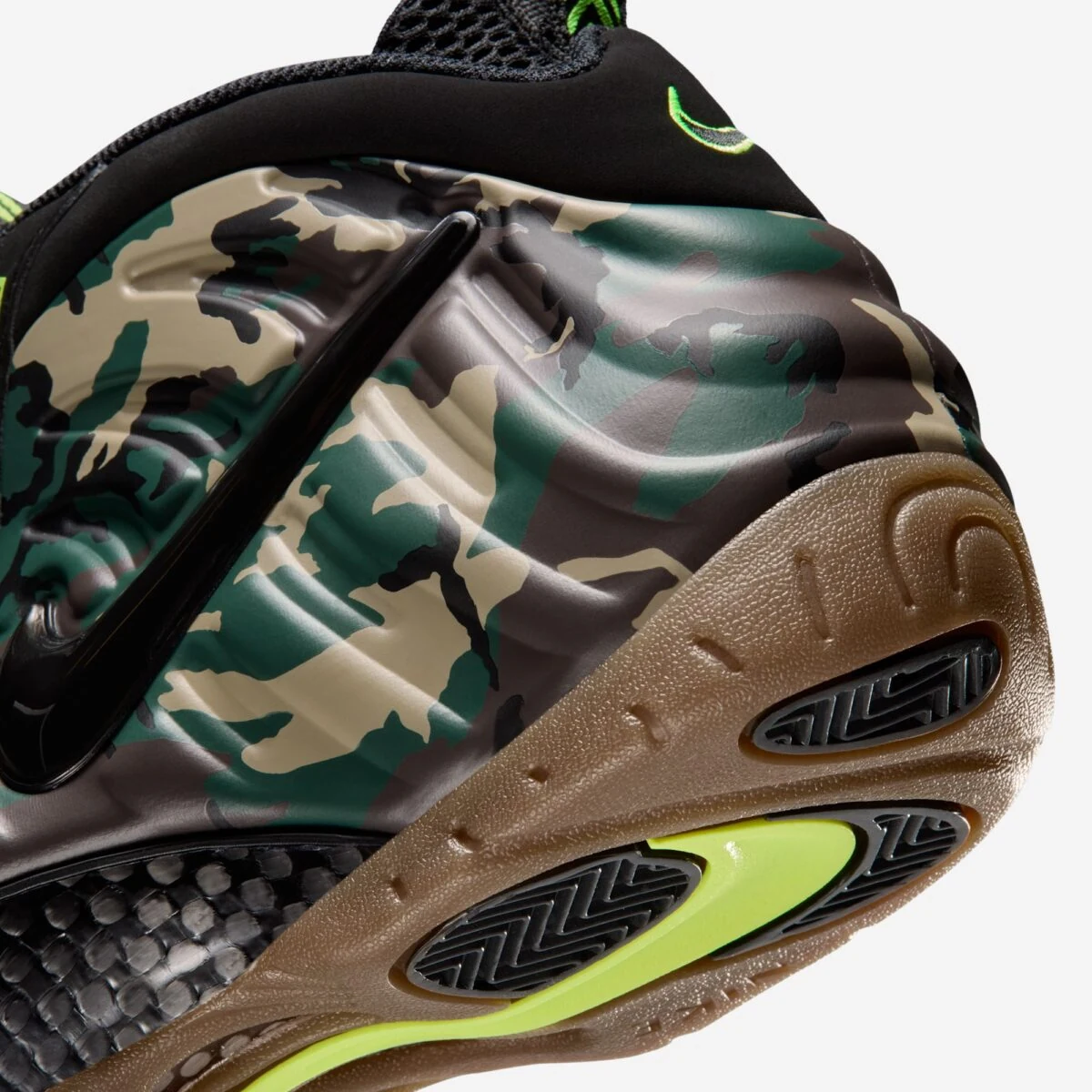 Close-up of the Nike Air Foamposite Pro Green Camo pattern and Gum Dark Brown outsole.