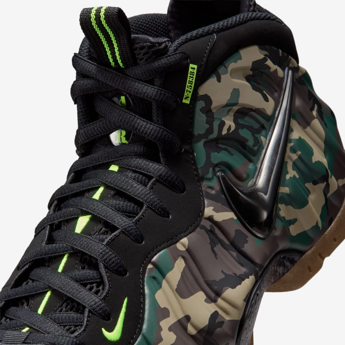 Close-up of the Nike Air Foamposite Pro Green Camo with black Swoosh, camo shell and Voltage Green details.