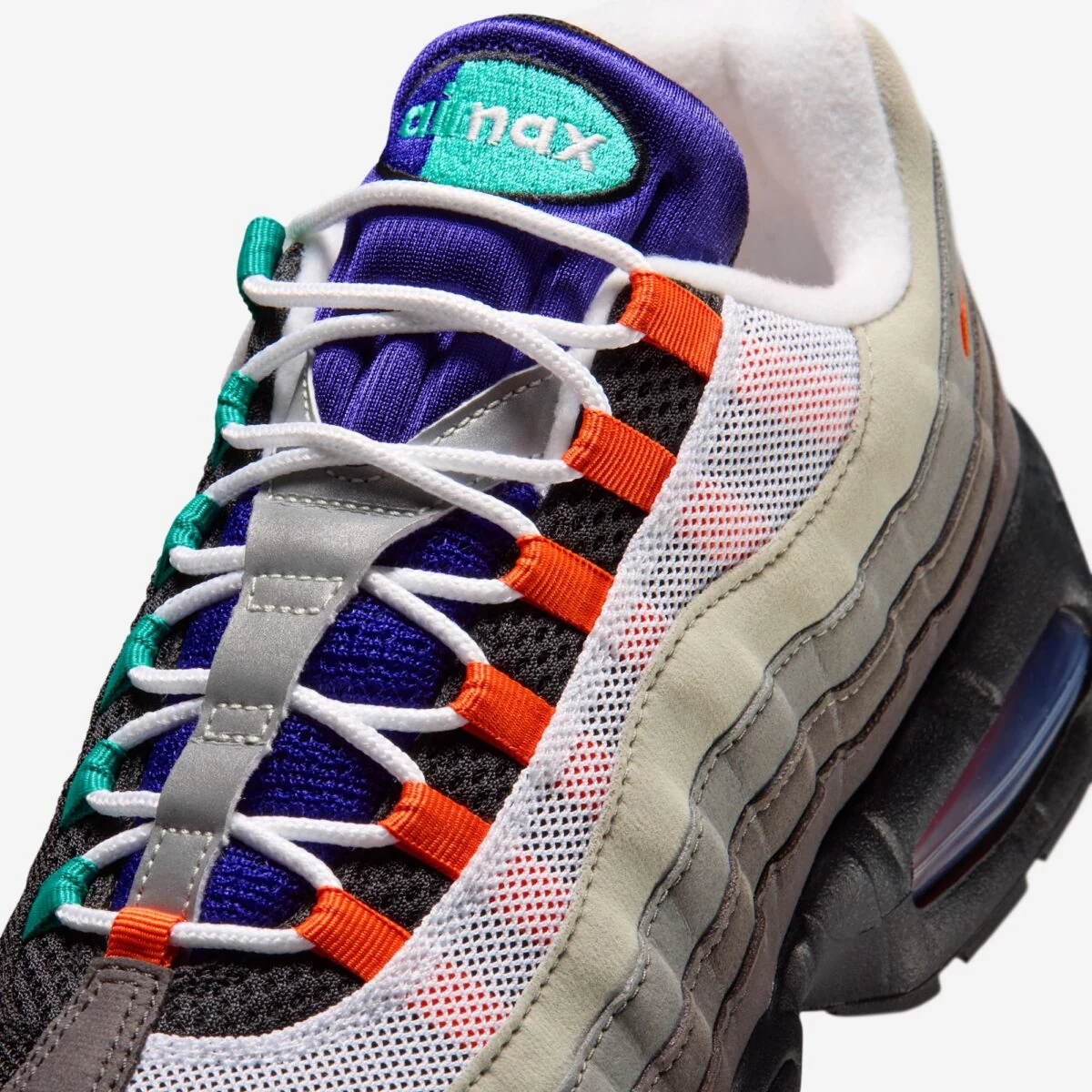 Close-up of the Nike Air Max 95 Greedy with purple tongue, aqua branding and Bright Mandarin lace loops.